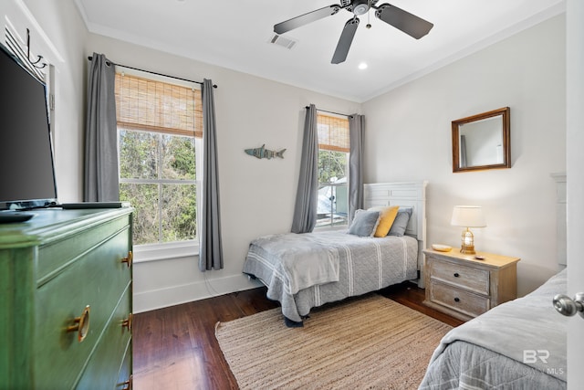 25773 Canal Rd Unit 28, Orange Beach, AL 36561 - bedroom with visible vents, baseboards, ornamental molding, ceiling fan, and hardwood / wood-style flooring