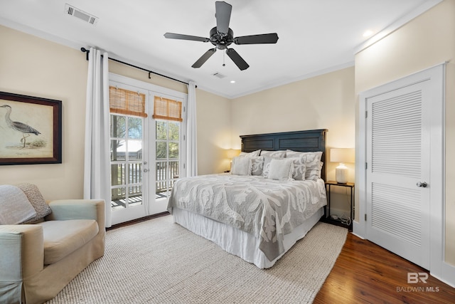 25773 Canal Rd Unit 28, Orange Beach, AL 36561 - bedroom featuring access to exterior, visible vents, crown molding, and wood finished floors