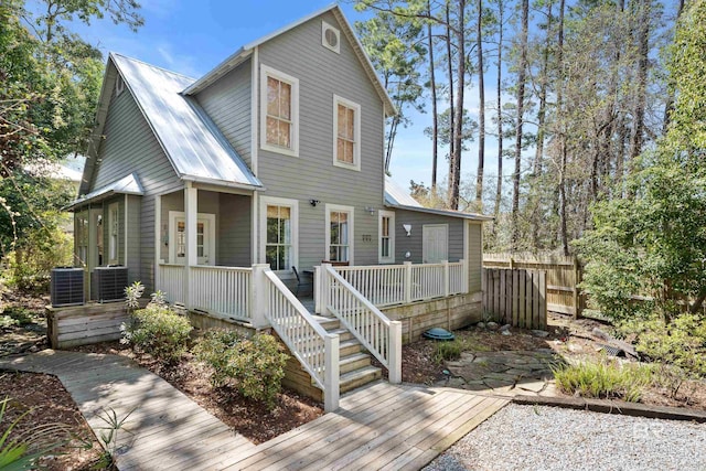 25773 Canal Rd Unit 28, Orange Beach, AL 36561 - view of front of property with a deck, fence, central AC, and metal roof