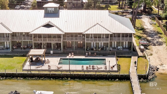 25773 Canal Rd Unit 28, Orange Beach, AL 36561 - exterior space with a fenced in pool, a yard, a patio area, and a water view