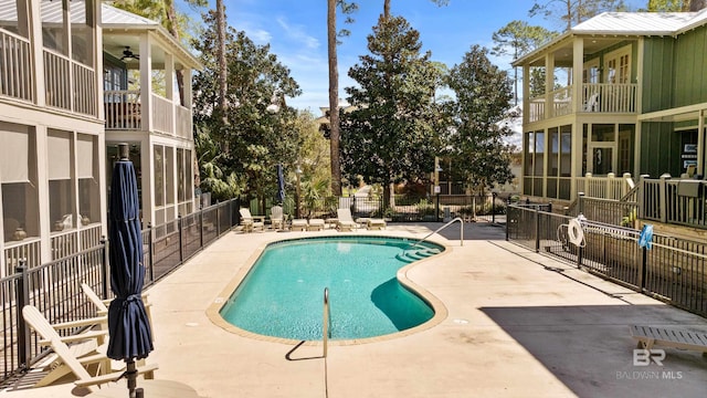 25773 Canal Rd Unit 28, Orange Beach, AL 36561 - community pool with a patio area, a ceiling fan, and fence