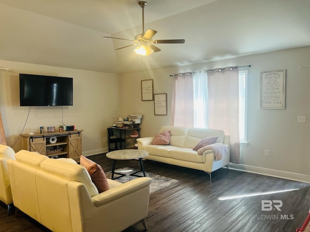 living room featuring lofted ceiling, dark hardwood / wood-style floors, and ceiling fan