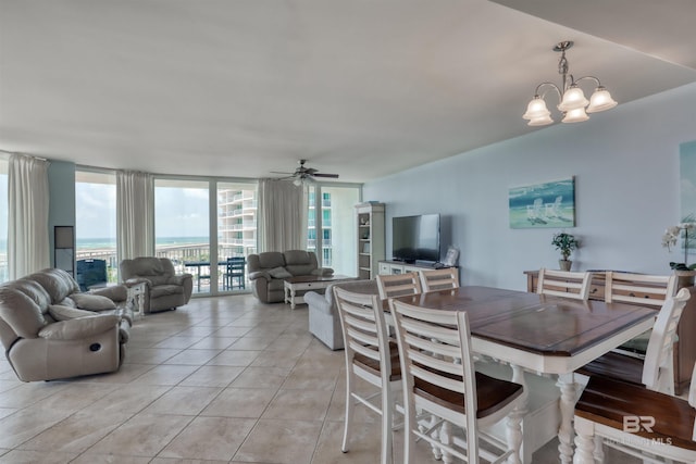 dining room with ceiling fan with notable chandelier and light tile floors