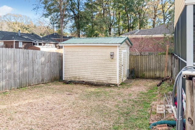 view of outdoor structure featuring a lawn