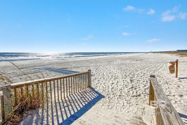 view of property's community with a view of the beach and a water view