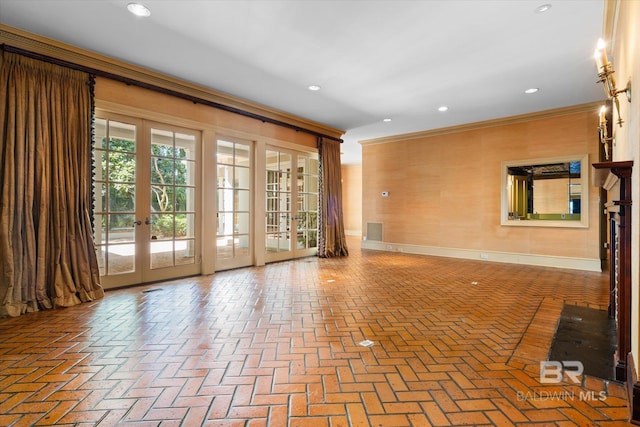 interior space with french doors and ornamental molding