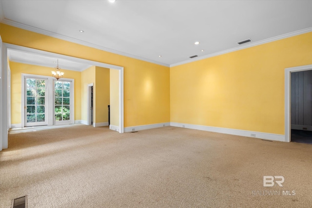 carpeted empty room featuring a notable chandelier and crown molding