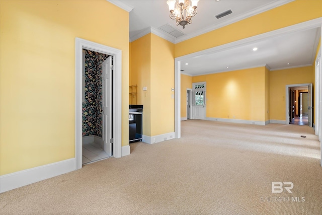 carpeted empty room with crown molding and a chandelier