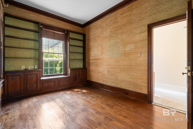 spare room with wood-type flooring