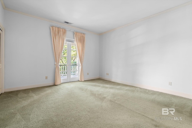 carpeted spare room with ornamental molding