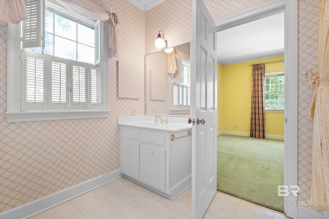 bathroom with vanity and ornamental molding