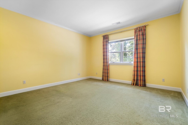 carpeted spare room with ornamental molding