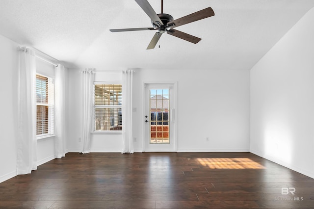 empty room featuring hardwood / wood-style floors, vaulted ceiling, and ceiling fan