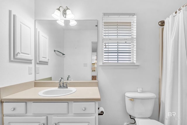 full bathroom featuring toilet and vanity