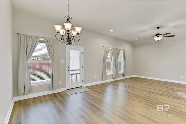 entryway with baseboards, light wood-style floors, and a healthy amount of sunlight