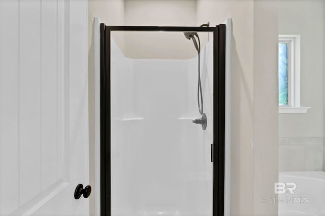 interior details featuring a stall shower