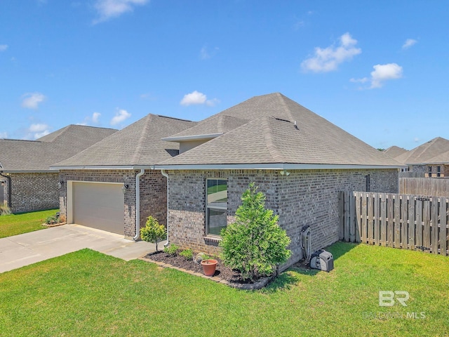 view of front of home with an attached garage, fence, a front lawn, a shingled roof, and brick siding