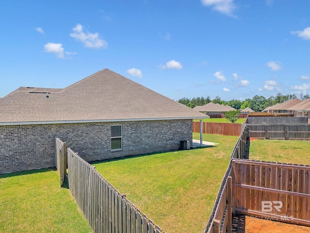 view of yard featuring cooling unit and a fenced backyard