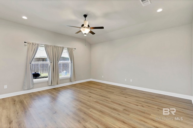 empty room featuring recessed lighting, baseboards, ceiling fan, visible vents, and light wood-type flooring
