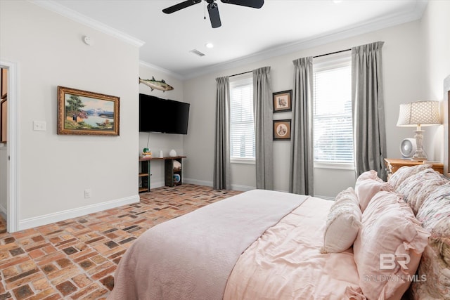 bedroom featuring ceiling fan, ornamental molding, and multiple windows