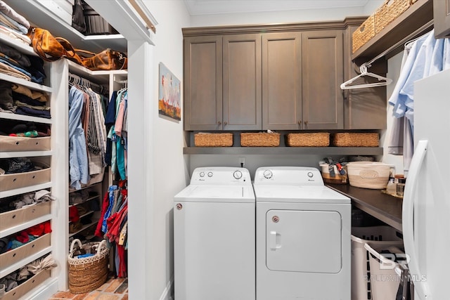 laundry area featuring cabinets and washing machine and clothes dryer