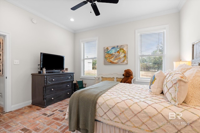 bedroom with ornamental molding and ceiling fan