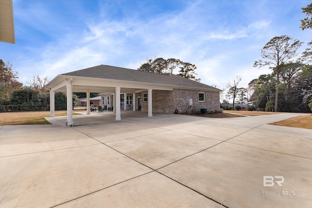 exterior space with a carport