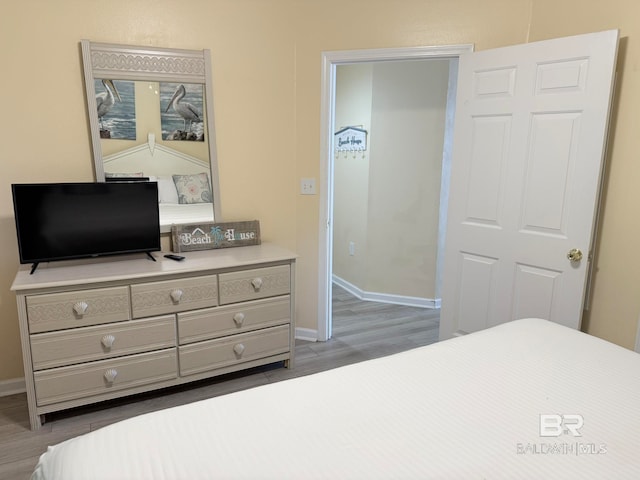 bedroom with wood-type flooring