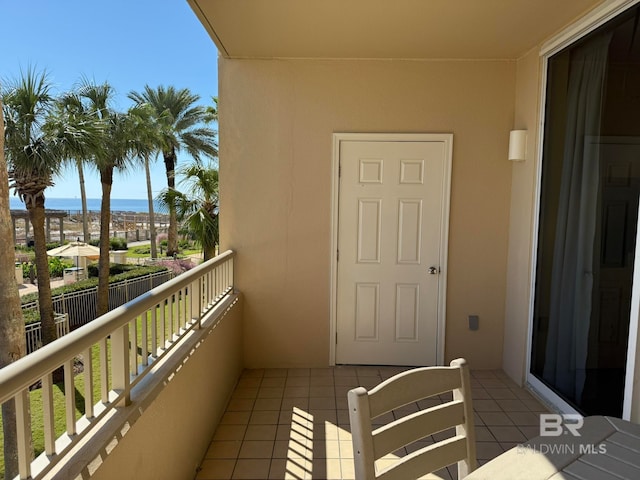 balcony featuring a water view