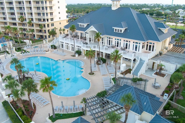 view of swimming pool with a patio