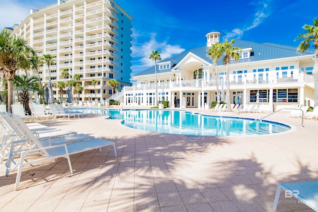 view of swimming pool featuring a patio area