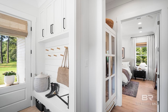 mudroom with light hardwood / wood-style flooring