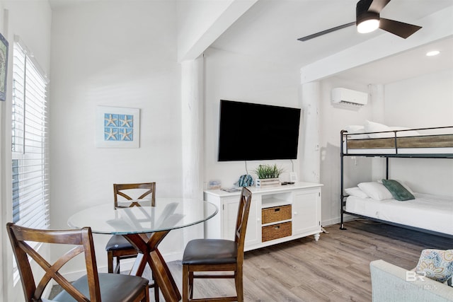 7166 Sharp Reef, Pensacola, FL 32507 - bedroom featuring an AC wall unit, light wood finished floors, and recessed lighting