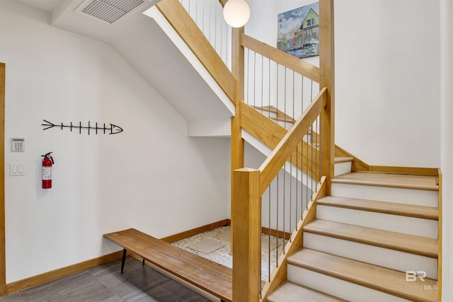 7166 Sharp Reef, Pensacola, FL 32507 - staircase with baseboards and lofted ceiling