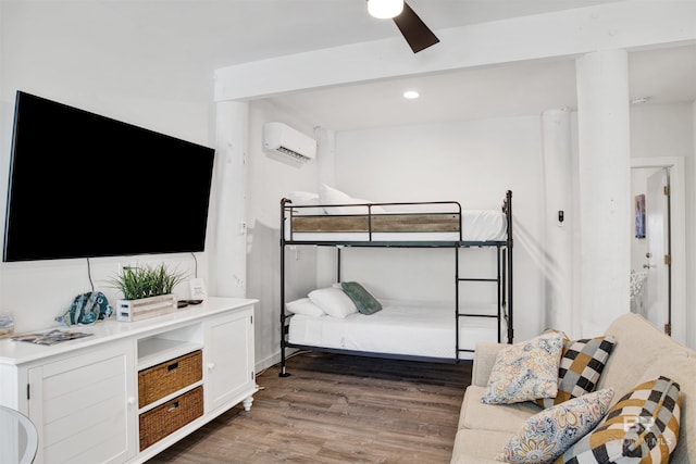7166 Sharp Reef, Pensacola, FL 32507 - bedroom with a wall mounted air conditioner, wood finished floors, and a ceiling fan