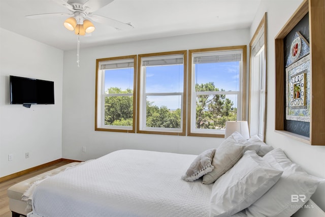 7166 Sharp Reef, Pensacola, FL 32507 - bedroom with wood finished floors and a ceiling fan