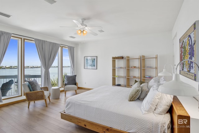 7166 Sharp Reef, Pensacola, FL 32507 - bedroom with a water view, wood finished floors, access to outside, and ceiling fan