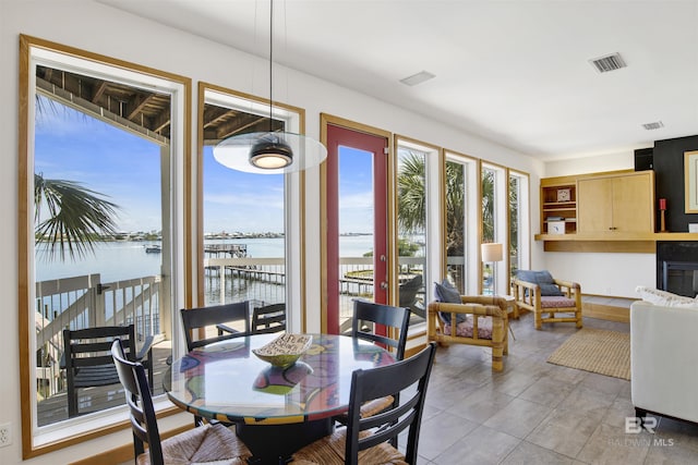 7166 Sharp Reef, Pensacola, FL 32507 - dining area with a water view and light tile patterned flooring