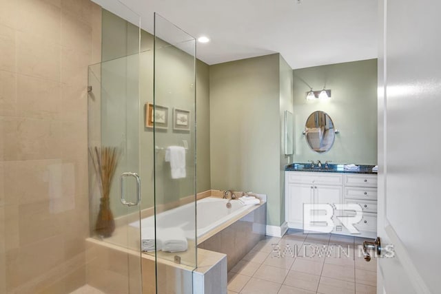 bathroom featuring tile patterned floors, vanity, and separate shower and tub