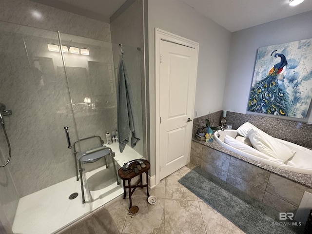 bathroom featuring separate shower and tub