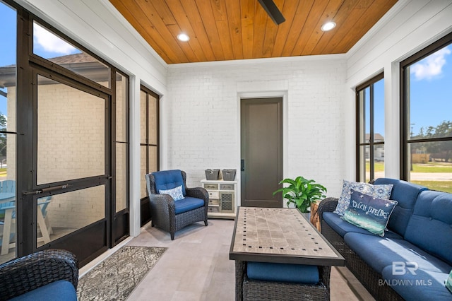 902 Inlet Cir, Gulf Shores, AL 36542 - living room featuring wooden ceiling, brick wall, and ornamental molding