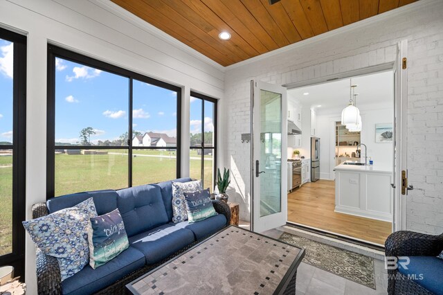 902 Inlet Cir, Gulf Shores, AL 36542 - sunroom featuring wood ceiling and a sink