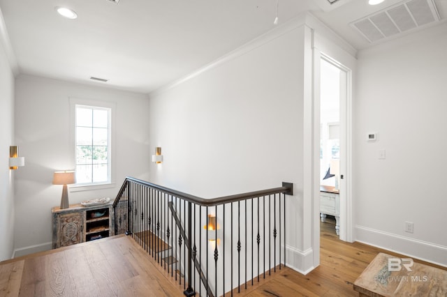 902 Inlet Cir, Gulf Shores, AL 36542 - corridor featuring hardwood / wood-style flooring, an upstairs landing, visible vents, and baseboards