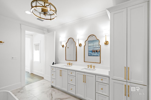 902 Inlet Cir, Gulf Shores, AL 36542 - bathroom featuring a chandelier, marble finish floor, crown molding, and a sink