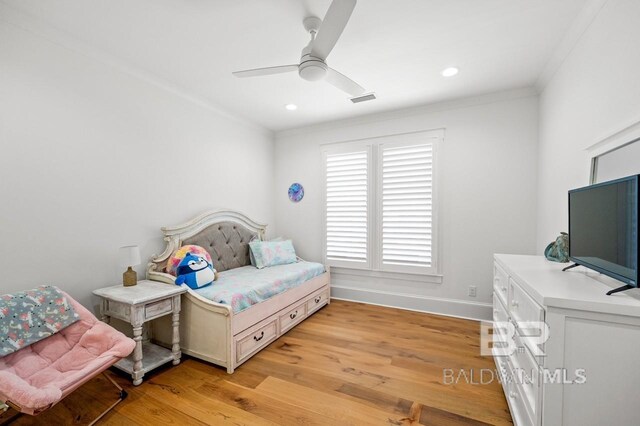 902 Inlet Cir, Gulf Shores, AL 36542 - bedroom with baseboards, visible vents, light wood finished floors, ceiling fan, and crown molding