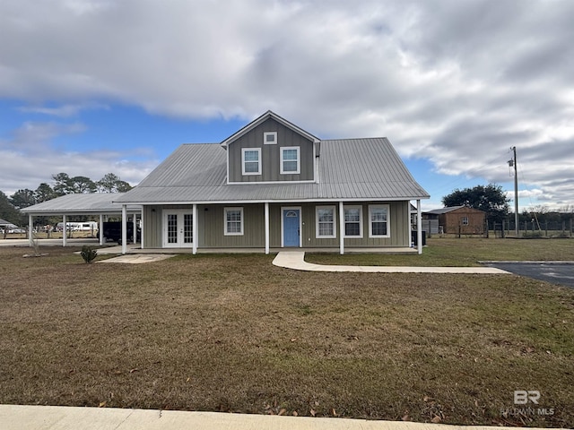 view of front of house with french doors and a front lawn