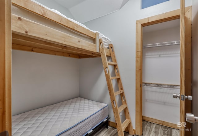 13450 County Road 91, Elberta, AL 36530 - unfurnished bedroom featuring wood-type flooring, lofted ceiling, and a closet