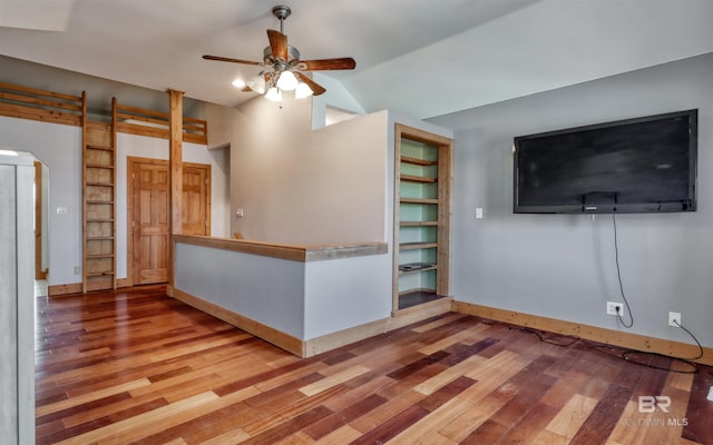 13450 County Road 91, Elberta, AL 36530 - unfurnished living room featuring built in shelves, ceiling fan, wood-type flooring, and lofted ceiling