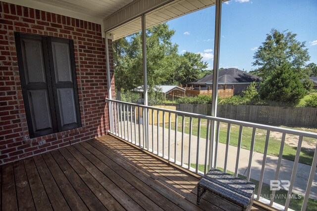 wooden deck featuring a yard