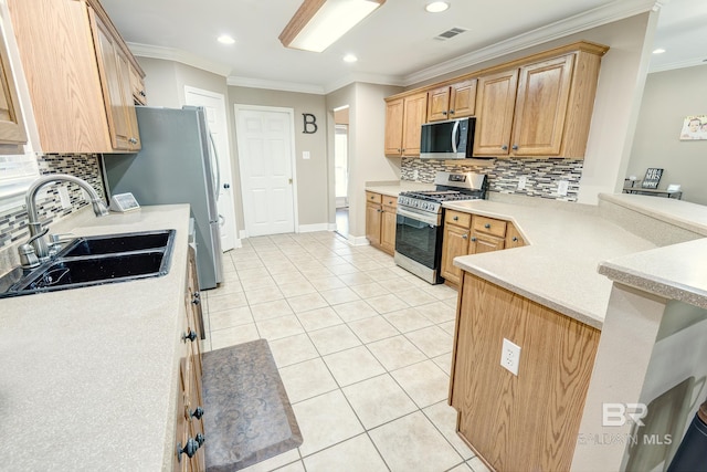 kitchen featuring light tile patterned flooring, decorative backsplash, crown molding, sink, and appliances with stainless steel finishes